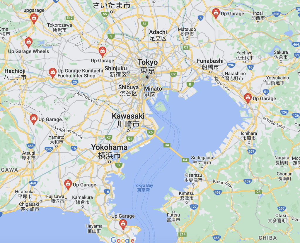Map showcasing multiple Up Garage locations around Tokyo, Yokohama, Kawasaki, Funabashi, and surrounding areas in Japan.