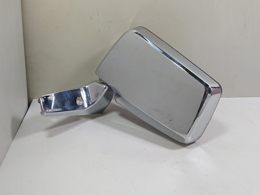 Chrome side mirror for vintage car on a white background, perfect for classic vehicle restoration projects.