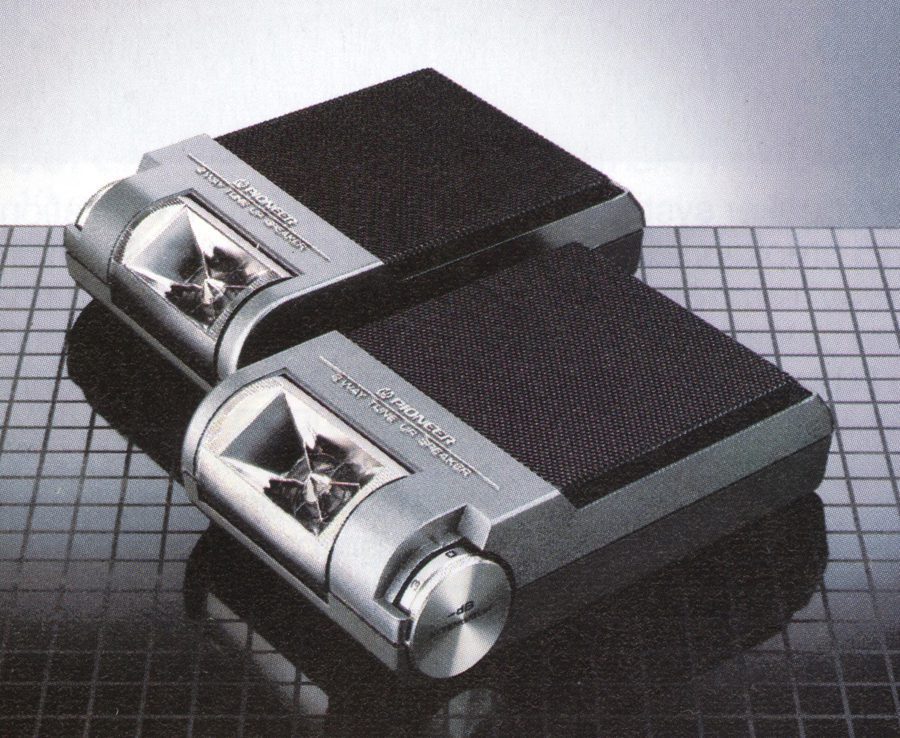 Vintage Pioneer tabletop speakers, close-up shot on a grid background, showcasing sleek design and quality audio equipment.