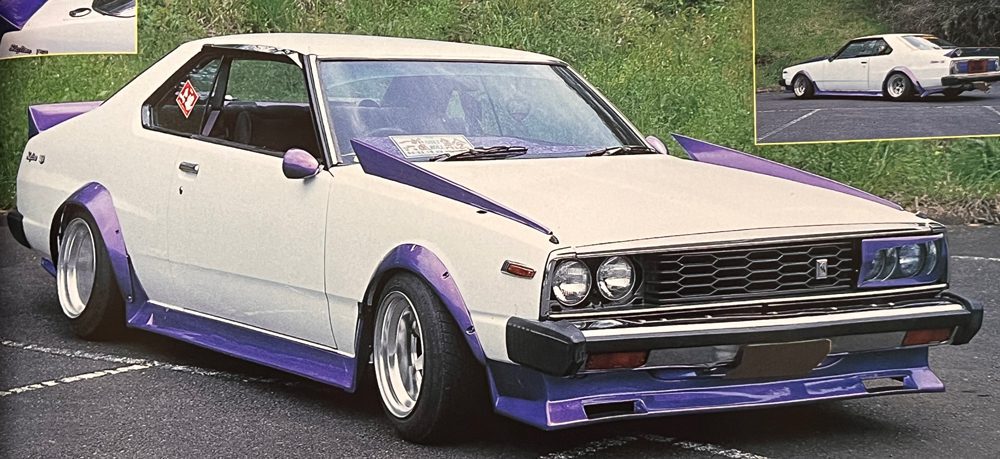 Vintage white and purple 1980s Nissan Skyline Race Car parked on asphalt, with side and rear angle views.
