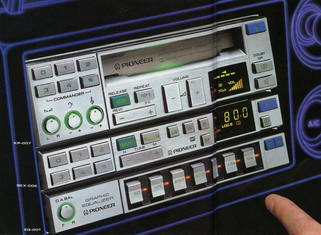 Close-up of a vintage Pioneer auto-reverse cassette deck with graphic equalizer and various controls, KP-007 model.